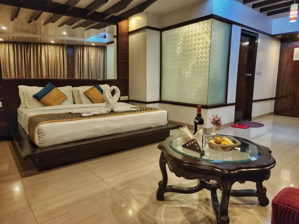 Luxury Honeymoon Suite at Hotel Surya Shimla with king-size bed, elegant interiors, romantic swan towel décor, spacious seating area, and premium amenities near Mall Road, Shimla.