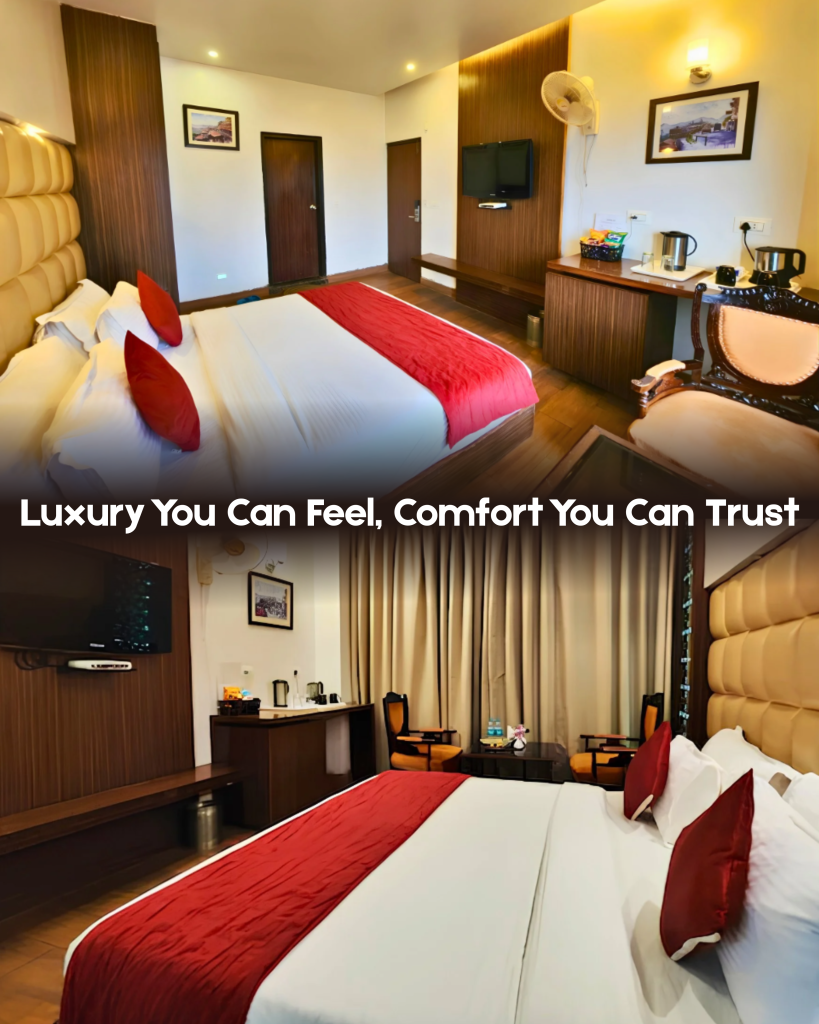 Spacious luxury hotel room in Shimla with king-size bed, red bedding accents, wooden furnishings, television, seating and modern amenities