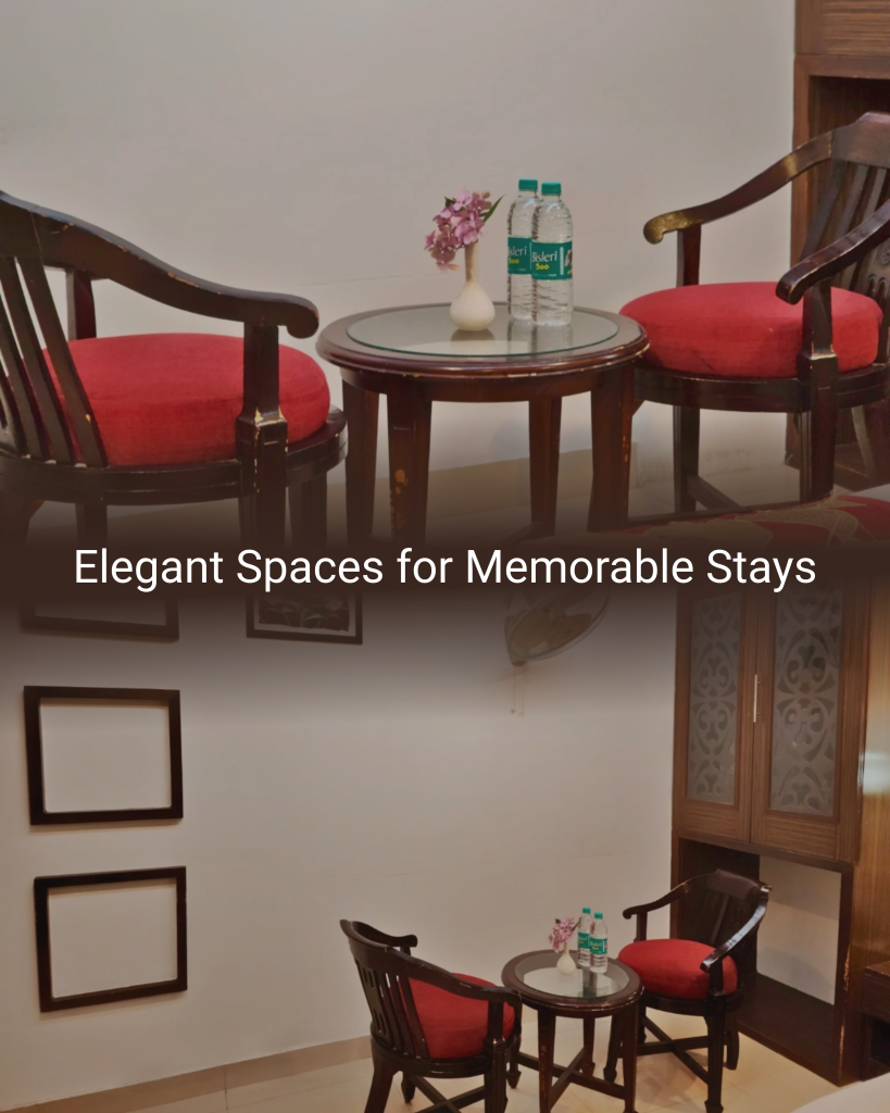 Elegant seating area with wooden chairs and table inside the Deluxe Suite at Hotel Surya Shimla