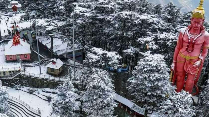 Jakhoo Temple Shimla and Hanuman statue surrounded by snow-covered deodar trees